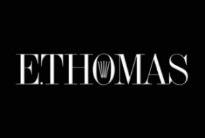 E. THOMAS